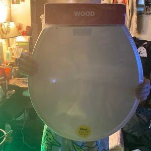 toilet seat , brand new. believe the brand is wood, ginsey not sure